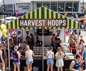 Exterior view of the Harvest Hoops tent near John Cain Arena